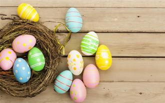colorful easter eggs on wooden surface